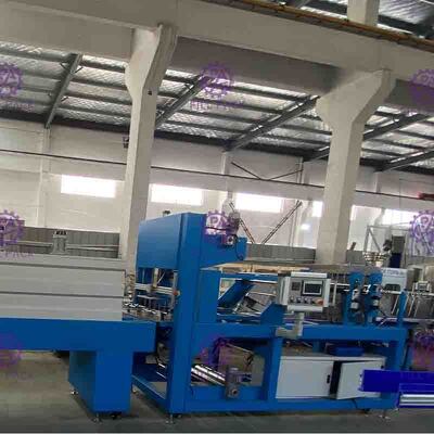 Linear Shrink Wrapper Sepenuhnya Otomatis Untuk Peralatan Pengemasan Botol Plastik Dengan Film Cetak